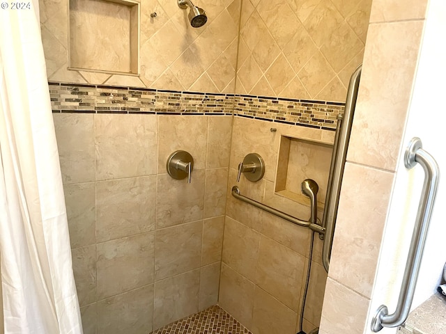 bathroom featuring a shower with curtain