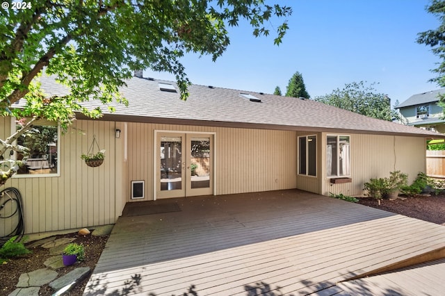 back of property with a wooden deck