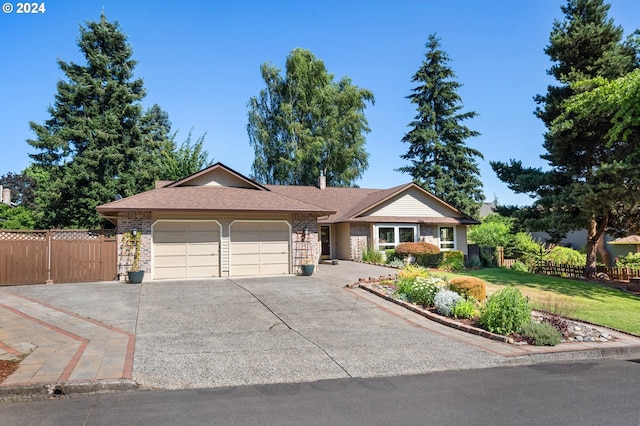 single story home with a garage and a front yard