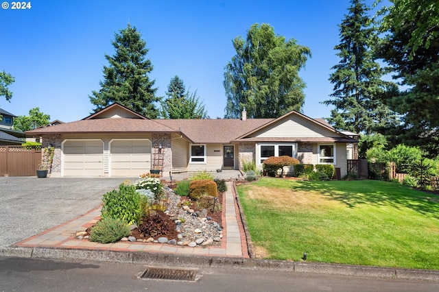 ranch-style house with a garage and a front yard