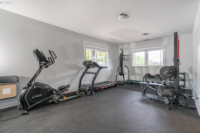 exercise area with a textured ceiling