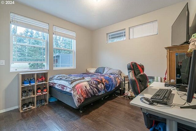 bedroom featuring dark hardwood / wood-style flooring