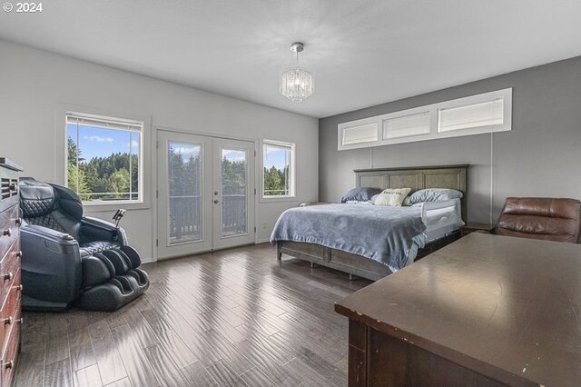 bedroom featuring wood-type flooring, multiple windows, access to exterior, and french doors