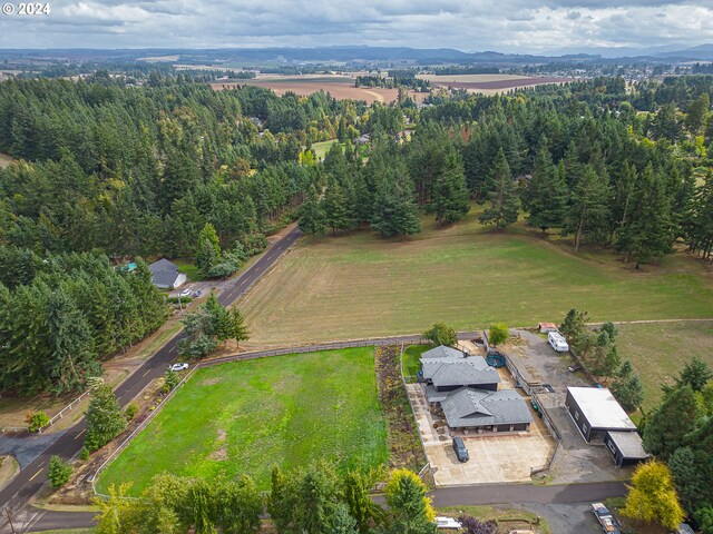 birds eye view of property with a rural view