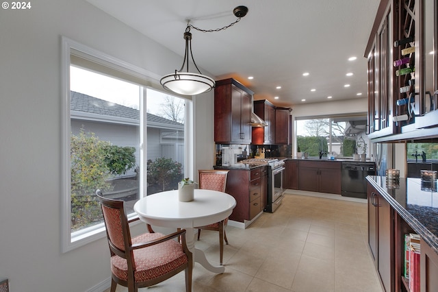 kitchen with black dishwasher, hanging light fixtures, light tile patterned floors, stainless steel gas range oven, and tasteful backsplash