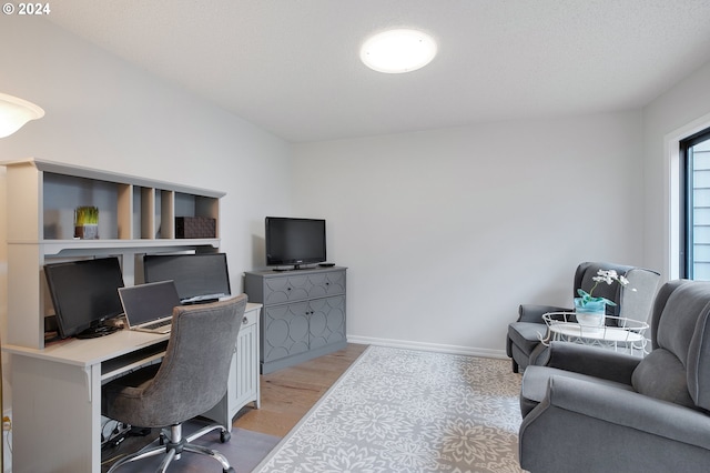 office area with light hardwood / wood-style flooring