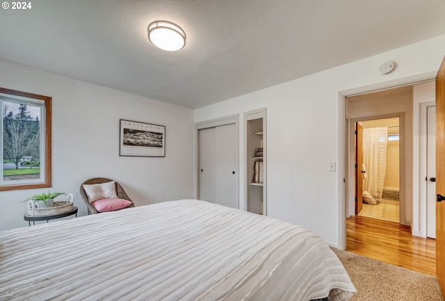 bedroom with light colored carpet