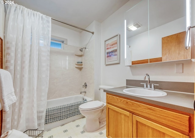 full bathroom with vanity, shower / bath combination with curtain, and toilet