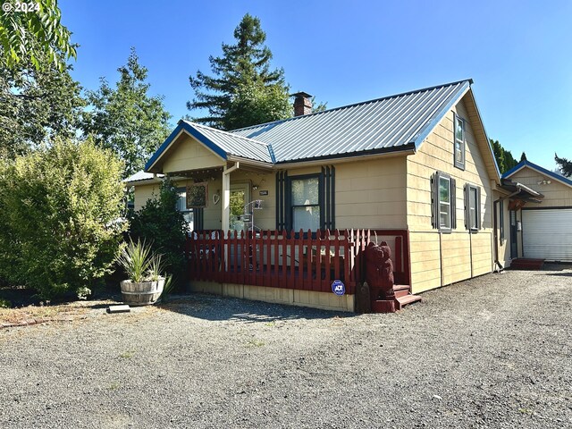 view of front of house featuring a garage and a porch