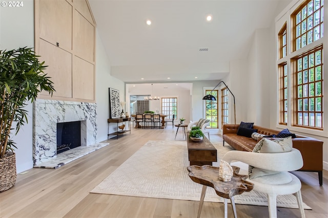 living room featuring a fireplace and light wood-type flooring