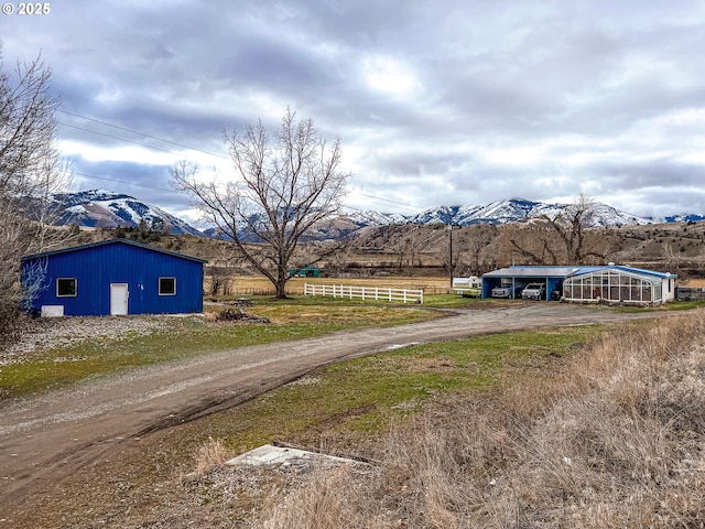 view of road with a mountain view and a rural view