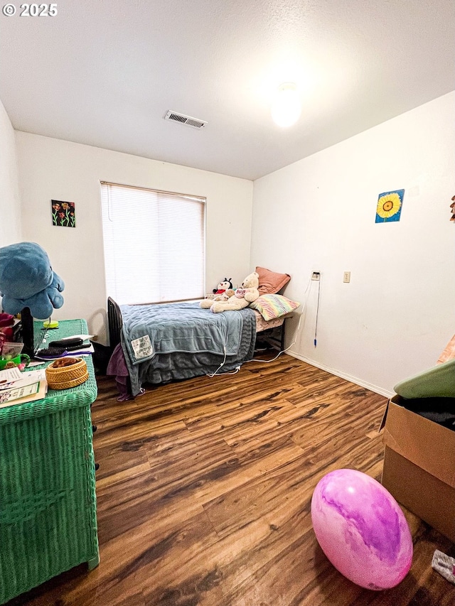 bedroom featuring hardwood / wood-style floors