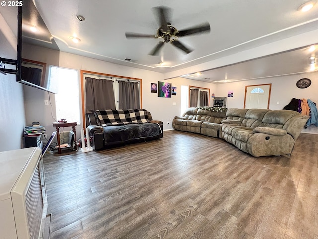 living room with ceiling fan and wood-type flooring