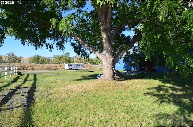 view of yard with a rural view