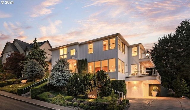 contemporary house featuring a balcony and a garage