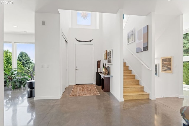 entrance foyer featuring concrete floors