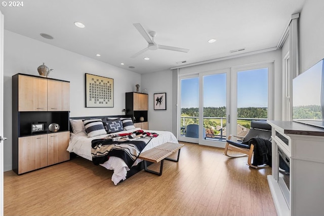 bedroom with ceiling fan, light hardwood / wood-style flooring, and access to outside