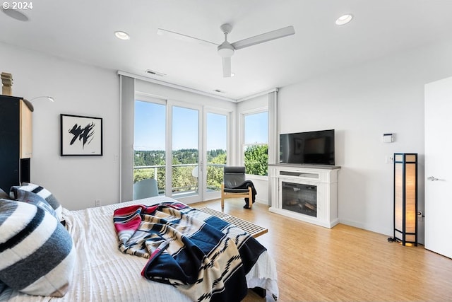 bedroom featuring light hardwood / wood-style floors and ceiling fan