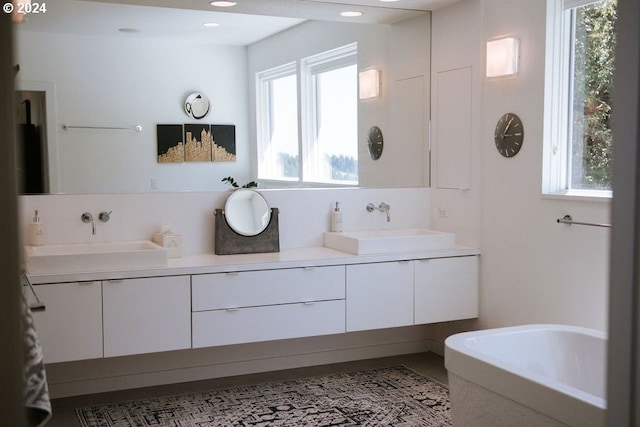 bathroom featuring vanity and plenty of natural light