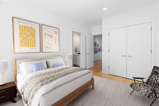 bedroom featuring a closet and light hardwood / wood-style flooring