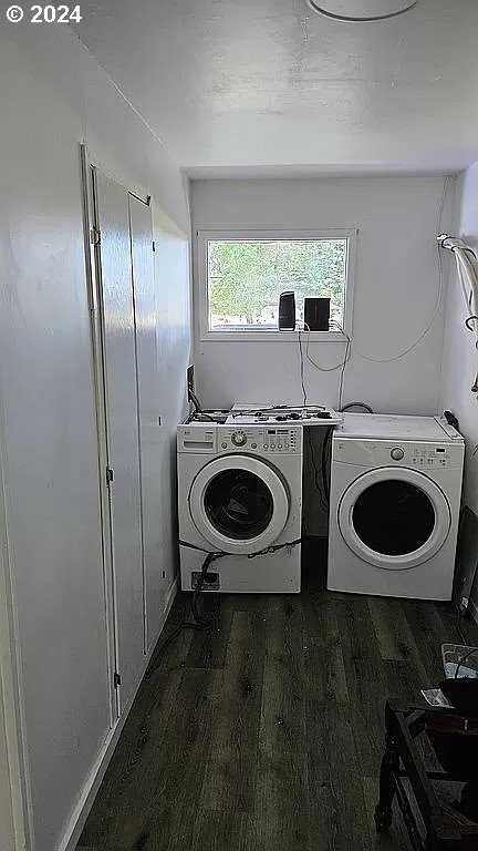 43460 Nicholson Dr, Port Orford, OR 97465 - laundry room featuring washer and dryer and wood finished floors