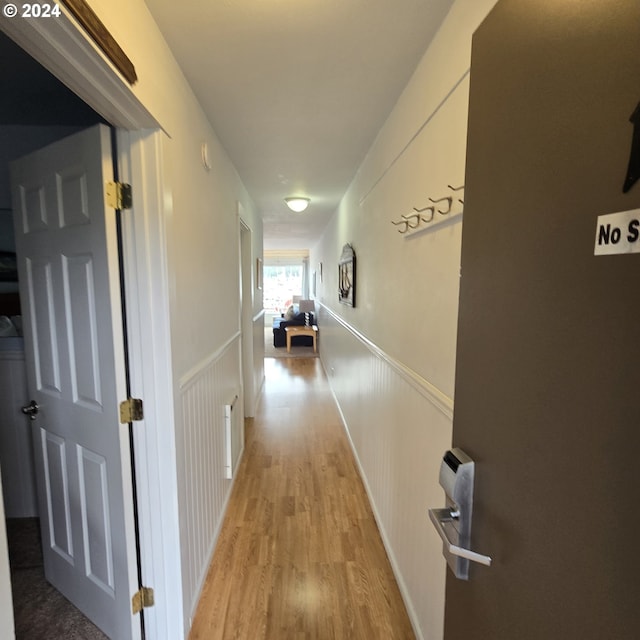 hallway with light wood-type flooring