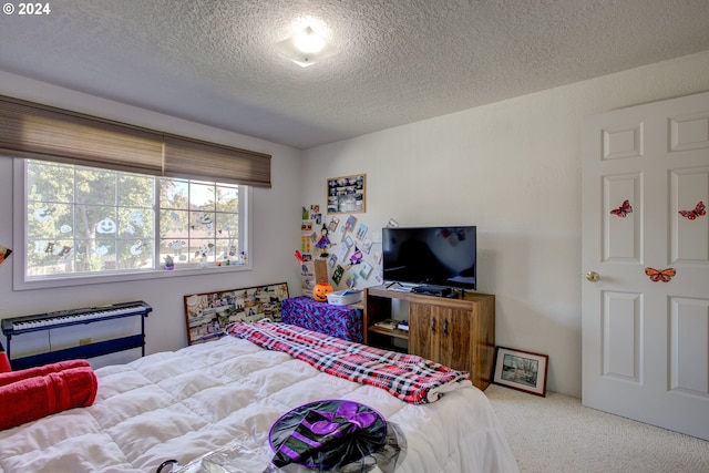 carpeted bedroom featuring a textured ceiling