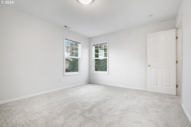 empty room featuring carpet floors