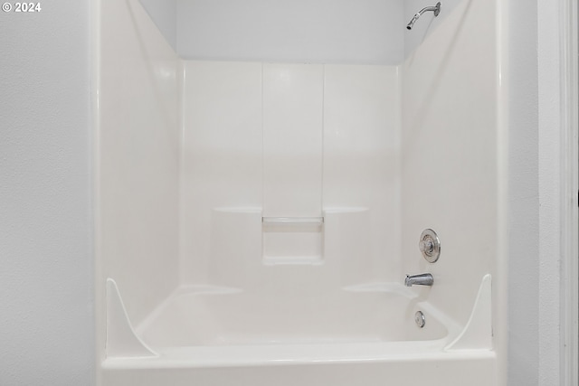 bathroom with bathing tub / shower combination