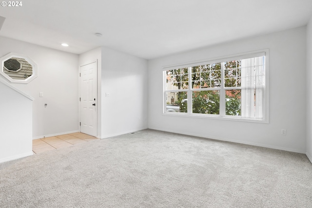 interior space featuring light colored carpet