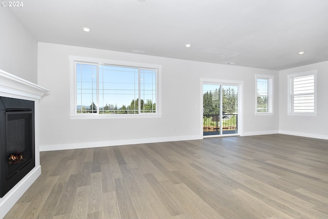 unfurnished living room featuring hardwood / wood-style floors