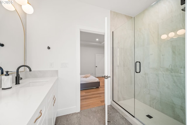 bathroom featuring an enclosed shower and vanity