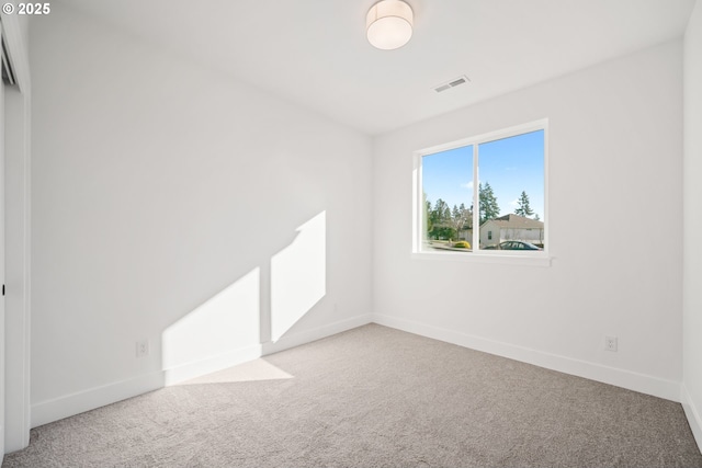 unfurnished room with carpet floors