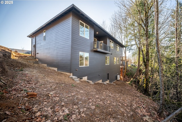 view of property exterior featuring a balcony