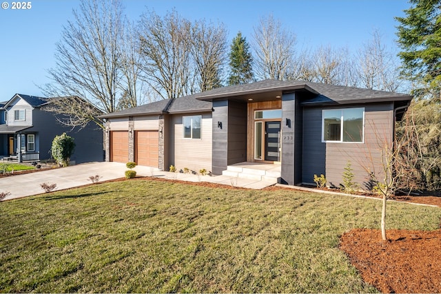 view of front of home with a garage and a front yard