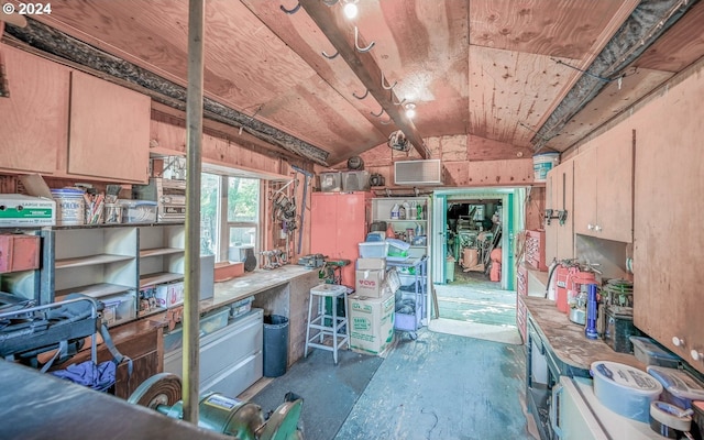 misc room featuring a workshop area and vaulted ceiling