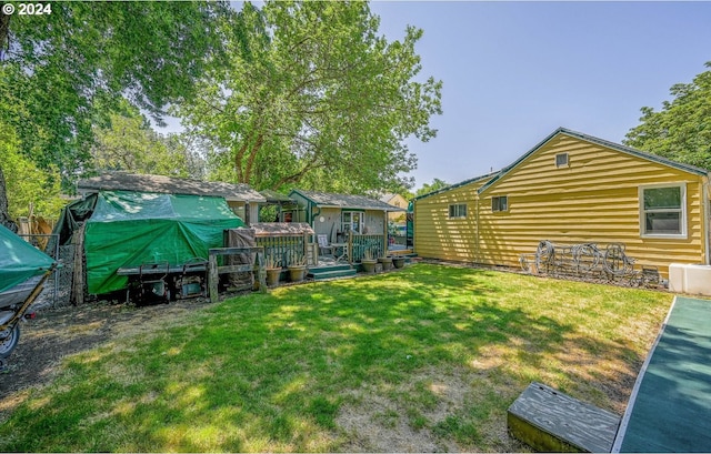 view of yard with a deck