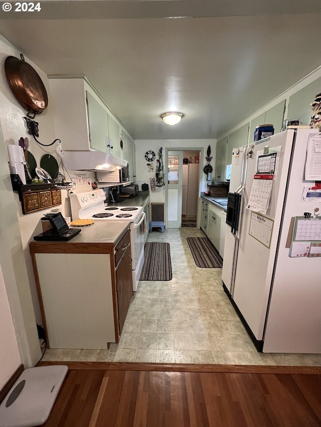 kitchen with white cabinetry, white appliances, and light wood-type flooring