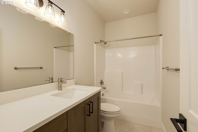 full bathroom with tile patterned flooring, vanity, bathing tub / shower combination, and toilet