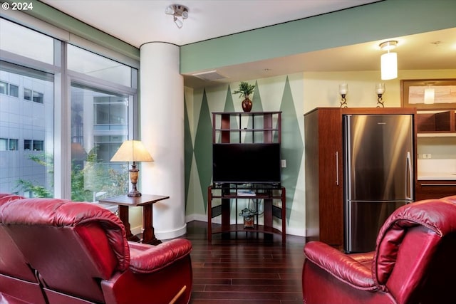 living area featuring wood finished floors and baseboards