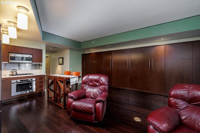living room featuring dark wood-style floors and visible vents