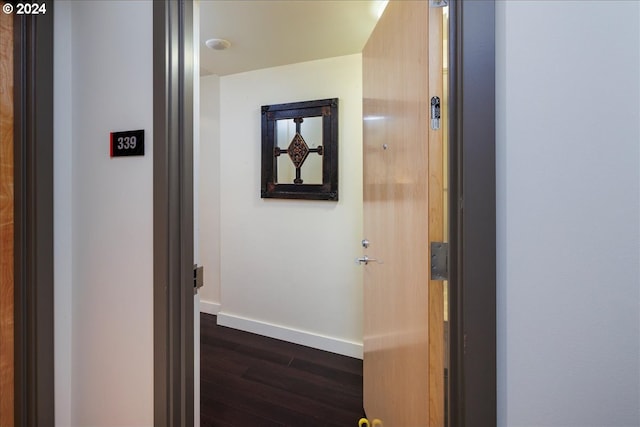 corridor featuring dark hardwood / wood-style floors