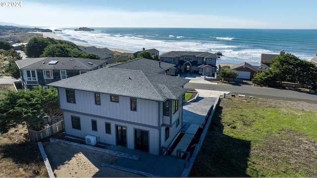 bird's eye view featuring a view of the beach and a water view