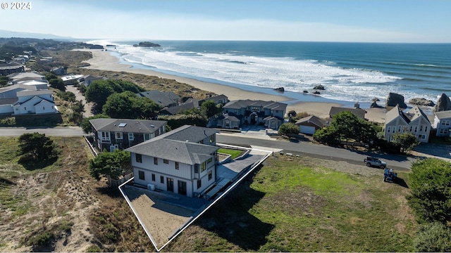 drone / aerial view with a view of the beach and a water view