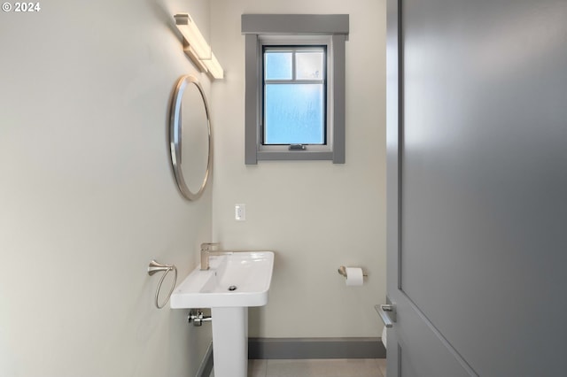 bathroom with tile patterned floors