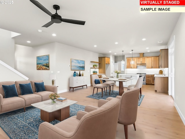 2854 NE Sweetwater Rd, Estacada, OR 97023 - living room with light wood-style flooring, baseboards, recessed lighting, and a ceiling fan