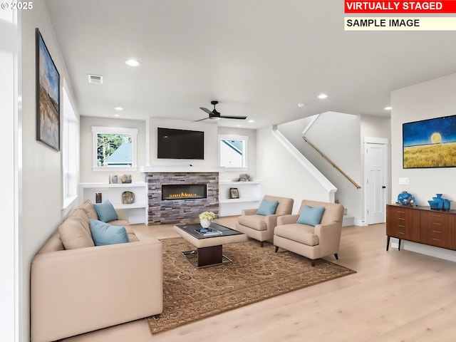 2854 NE Sweetwater Rd, Estacada, OR 97023 - living area with visible vents, recessed lighting, a ceiling fan, wood finished floors, and a fireplace