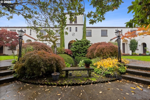 mediterranean / spanish house with a front yard