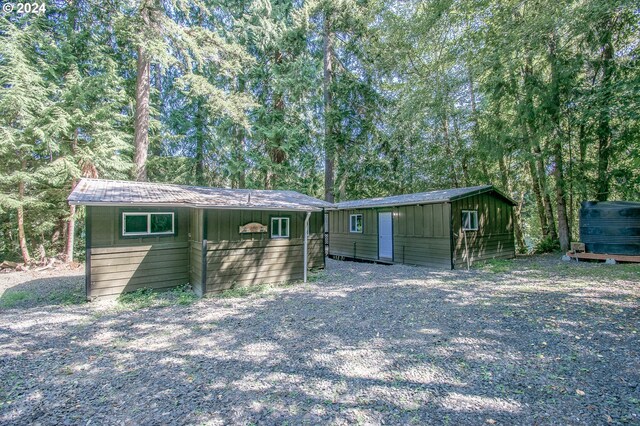 view of front of house with an outbuilding