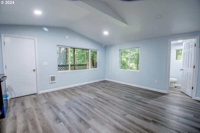 interior space featuring vaulted ceiling and light wood-type flooring